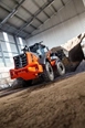 Wheel Loader dropping dirt,New Hitachi working in field,Hitachi Loader inside working,New Loader moving dirt in yard